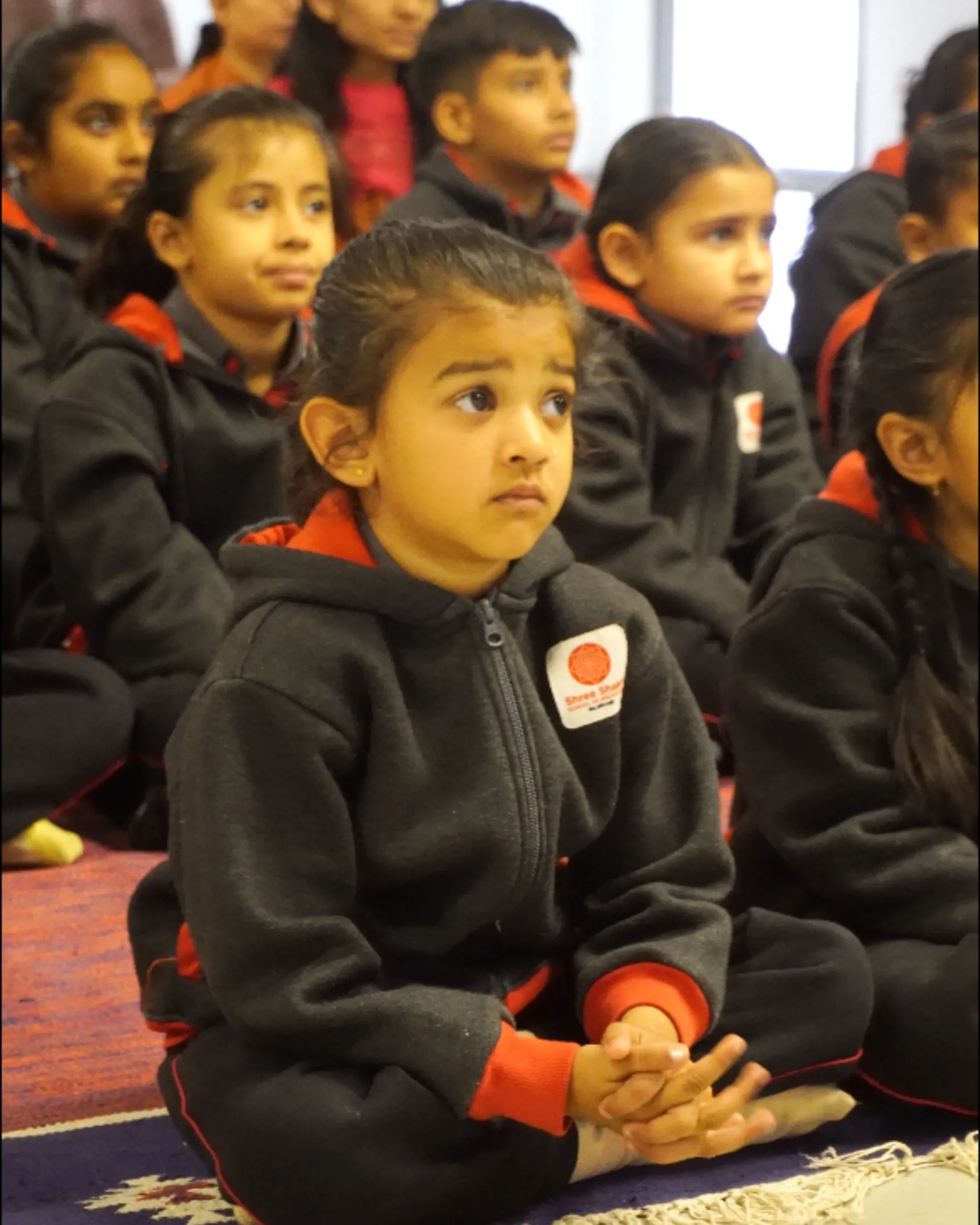 Attentive School Children Sitting In Uniform