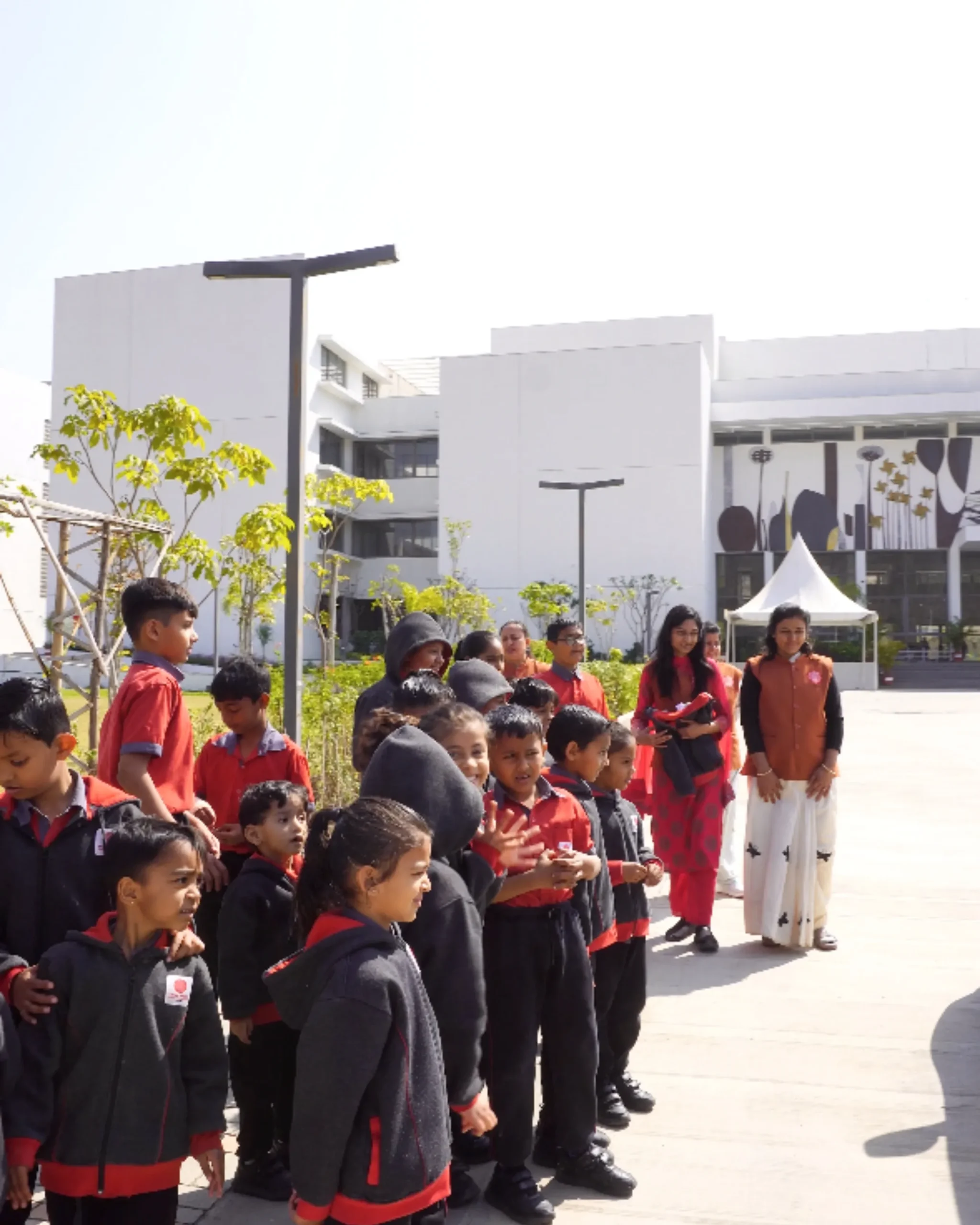 School Children Standing Outside Campus Building