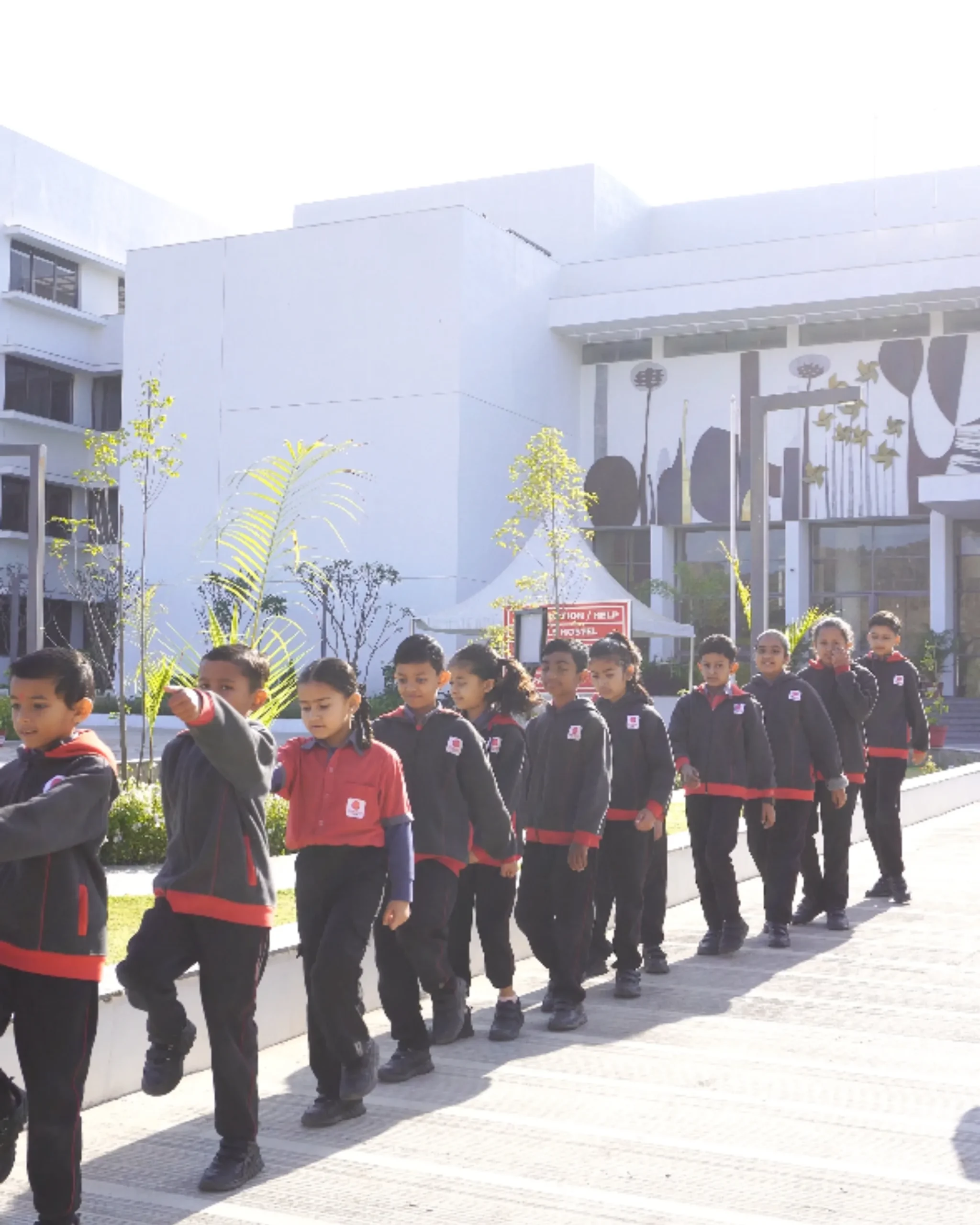 School Children Walking In Line On Campus