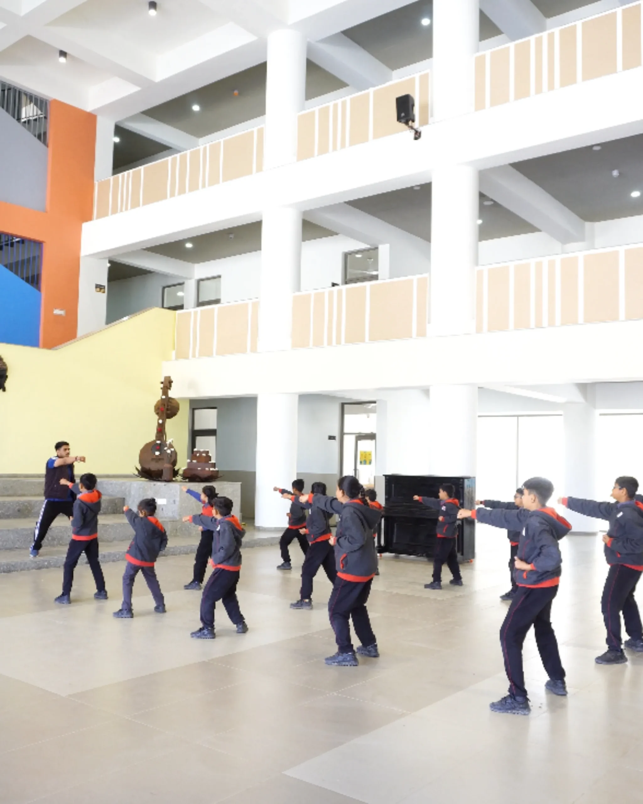 Students Karate Training In School Hall