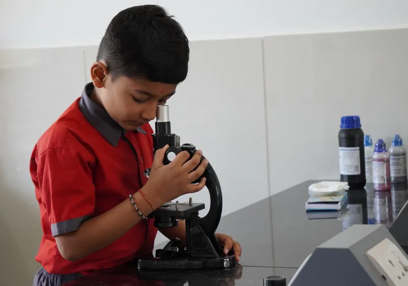 Students engaged in open sky learning under trees at Shree Shakti School of Innovation