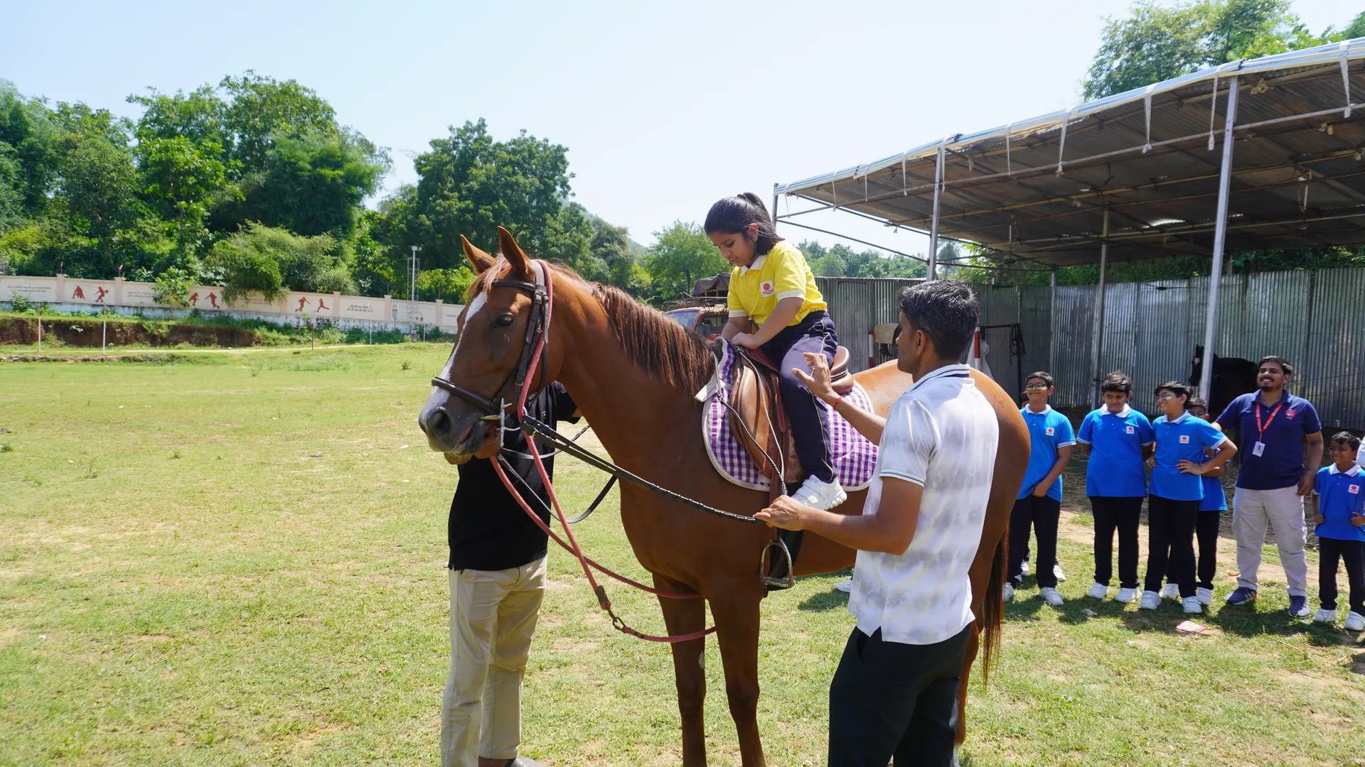 Children learning horse riding at SSI Ambaji with instructor guidance developing physical coordination and discipline