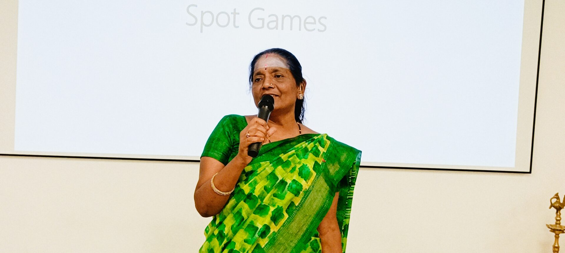 Grandparents enjoying spectacular student performance at SSI Ambaji school event